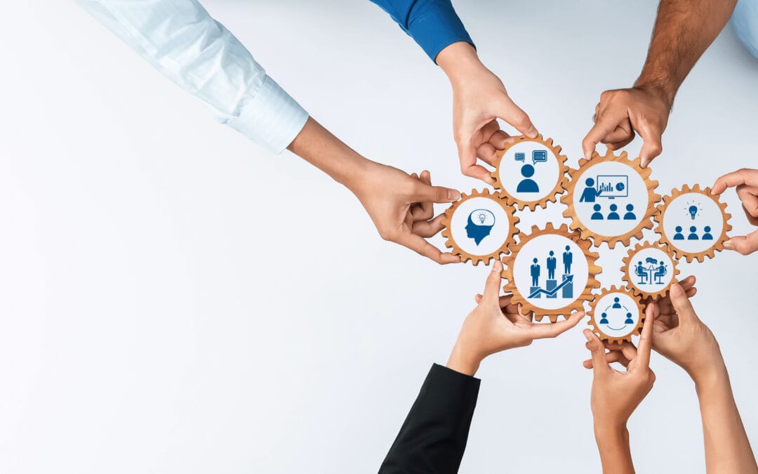 collaborative teamwork concept with diverse hands supporting business and innovation through graphic gear icons on a light background. amity